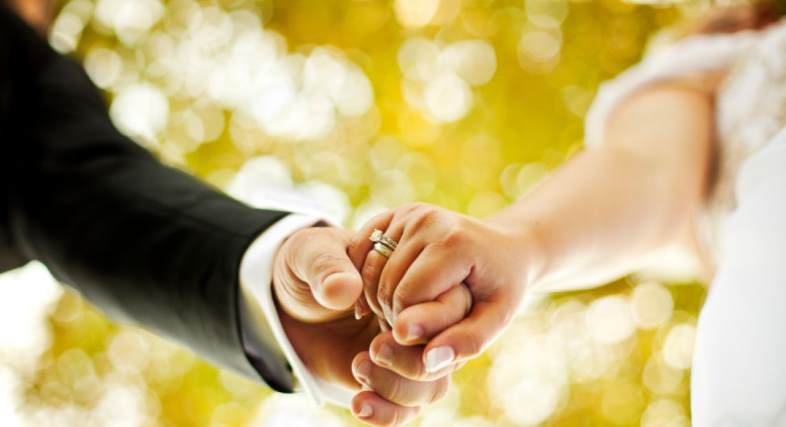 Couple-Holding-Hands-Getting-Married.jpg