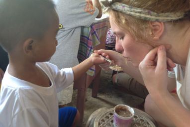 volunteer-feeds-child-in-philippines-1200.jpg