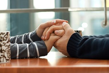 couple-holding-hands-table-900px__42290_zoom.jpg