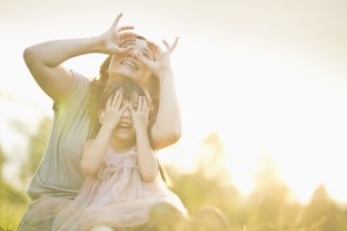 mother-and-child-playing-under-sunset-1.jpg