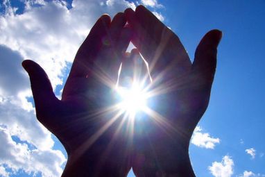 PHOTO-HANDS-HOLDING-SUN-BLUE-SKY.jpg
