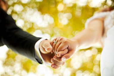 Couple-Holding-Hands-Getting-Married.jpg